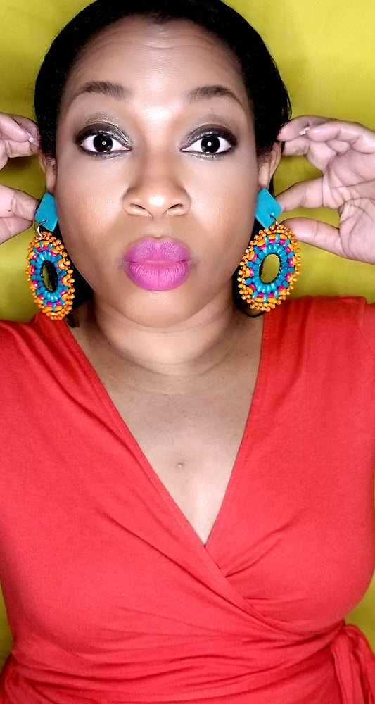 bright blue, orange, and and pink woven wooden earrings